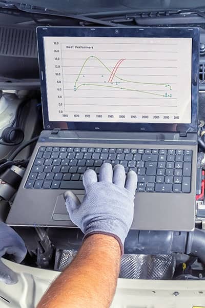 Mobile mechanic diagnostic car in client garage